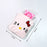 White Hello Kitty hot water bottle for relief
