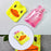 Small hot water bag with yellow duck design, ideal for pain relief